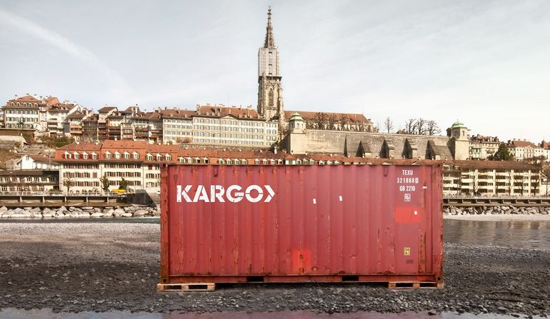 A shipping container labelled ‘KARGO’ on the River Aare in Bern 